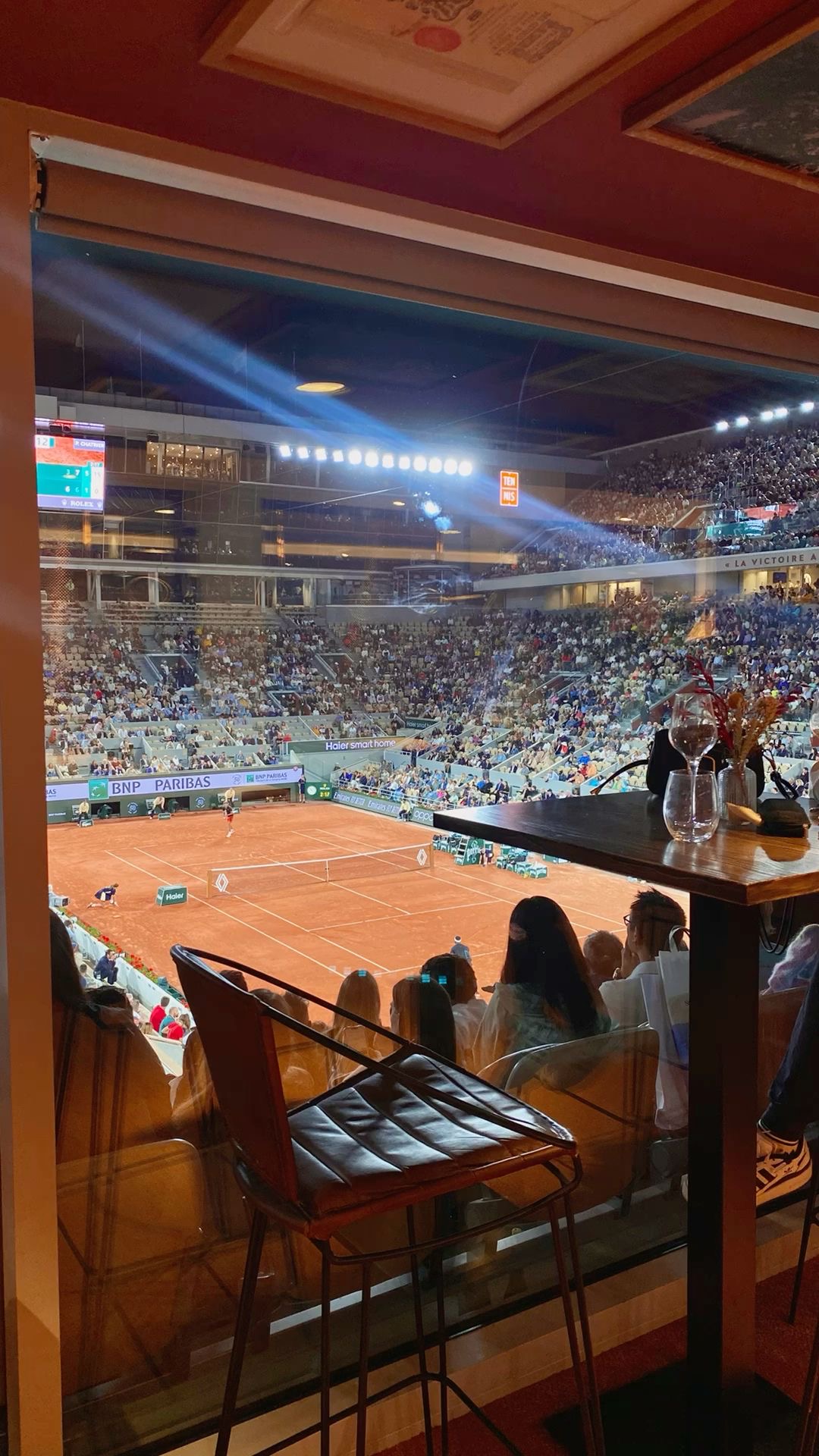 Private hospitality suite overlooking a tennis court